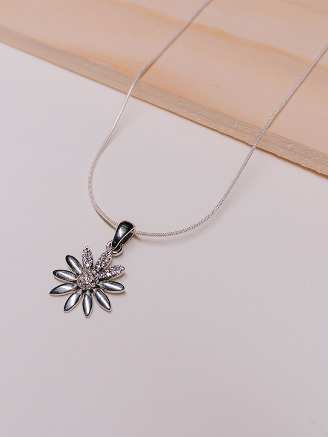

Ruhaani Sterling Silver Rhodium-Plated Cubic Zirconia Radiant Sunflower Pendant With Chain