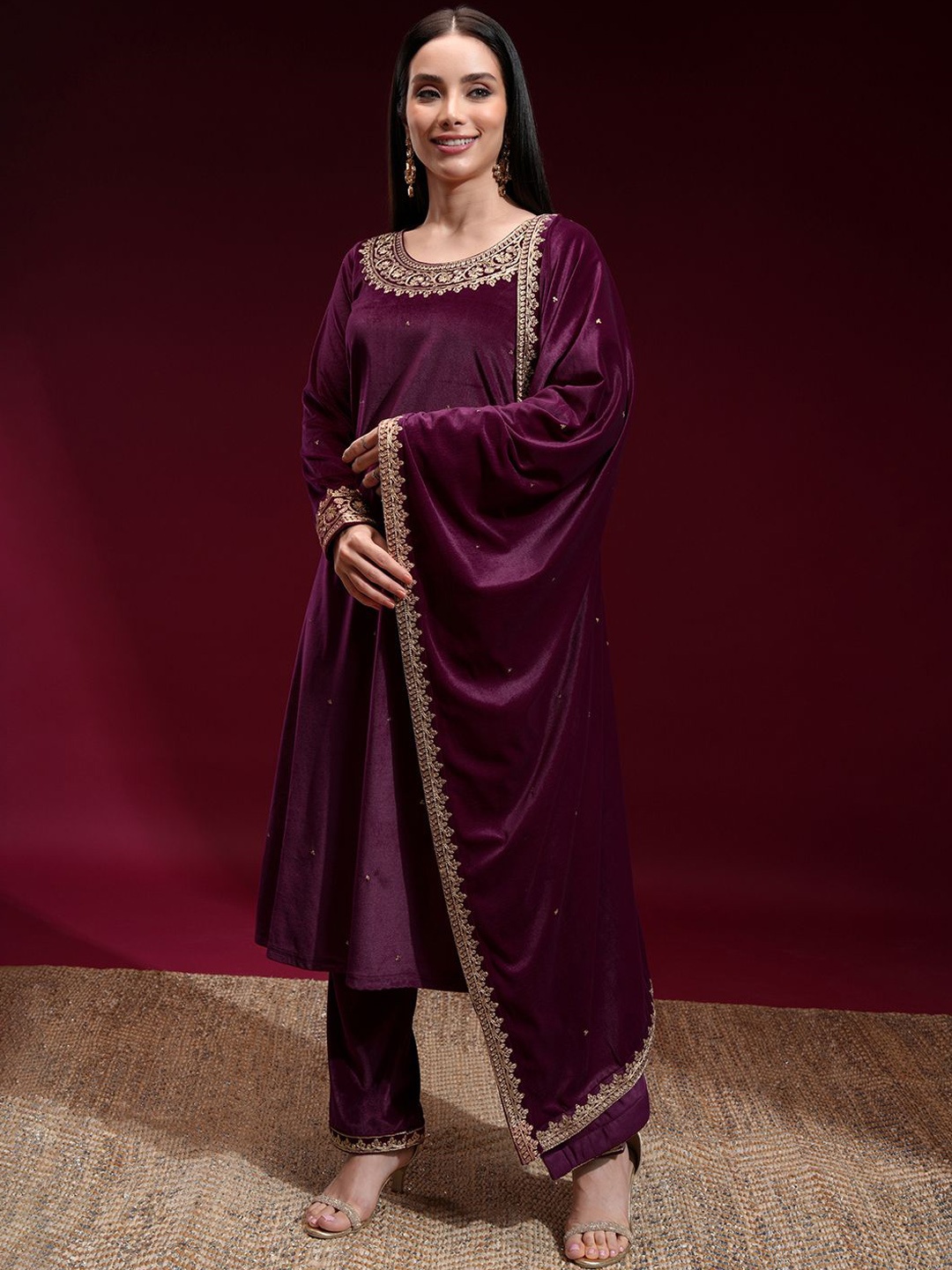 

Vishudh Floral Embroidered Sequnnied Velvet Straight Kurta With Trousers And Dupatta, Purple