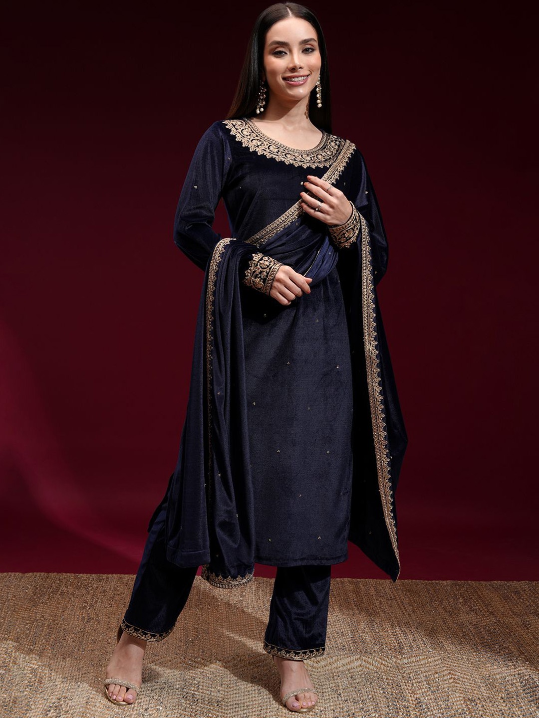 

Vishudh Floral Embroidered Sequnnied Velvet Straight Kurta With Trousers And Dupatta, Navy blue