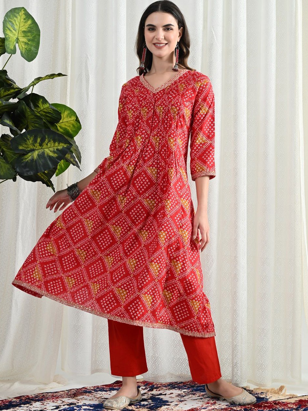 

SIJOPA Bandhani Printed Sequinned Pleated Anarkali Kurta with Trousers And Dupatta, Red