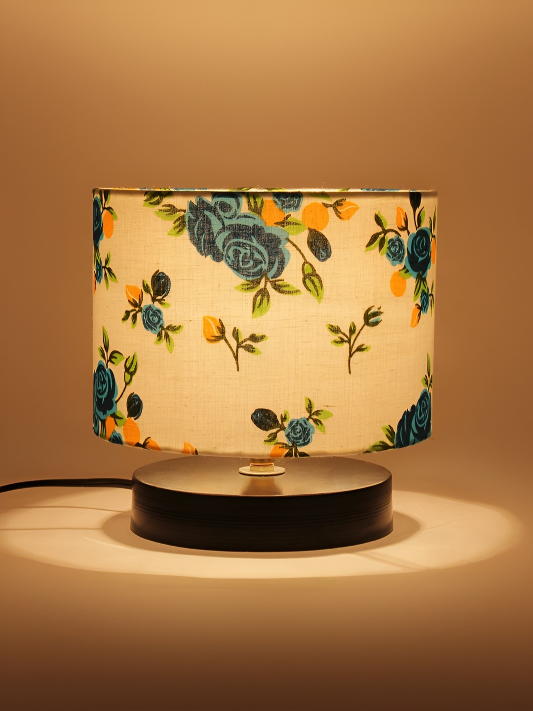 

Aura White and Blue Floral Printed Wooden Cylindrical Shaped Table Lamp