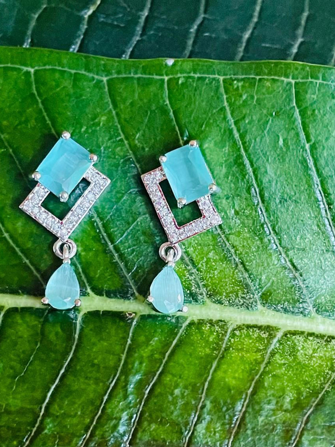 

MONI LIFESTYLE Silver Plated Artificial Stones Studded Square Shaped Drop Earrings