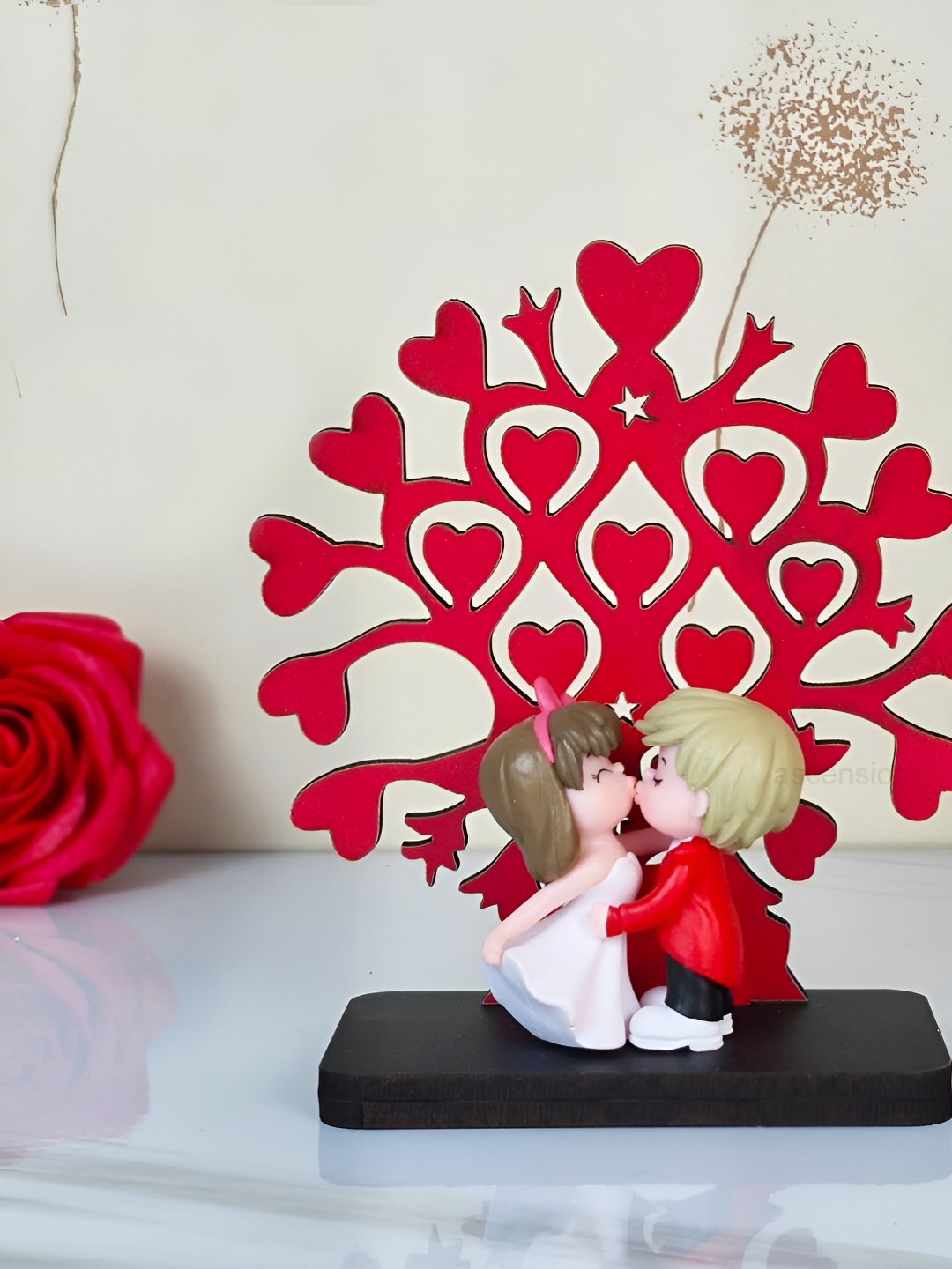 

Ascension Red & White Love Kissing Couple With Tree Stand Showpiece
