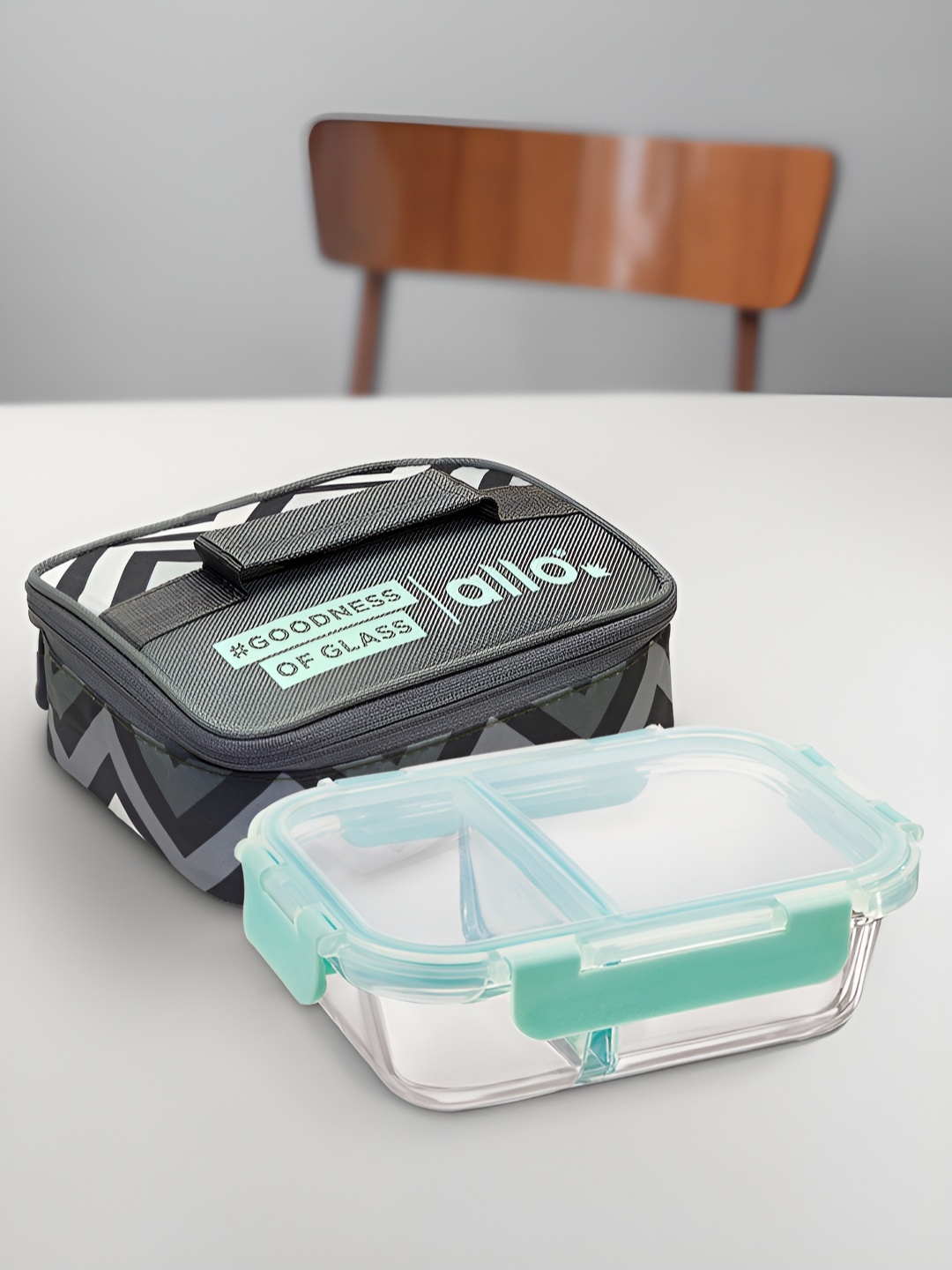 

Allo Transparent & Sea Green Glass Microwave Safe Lunch Box With Chevron Printed Bag