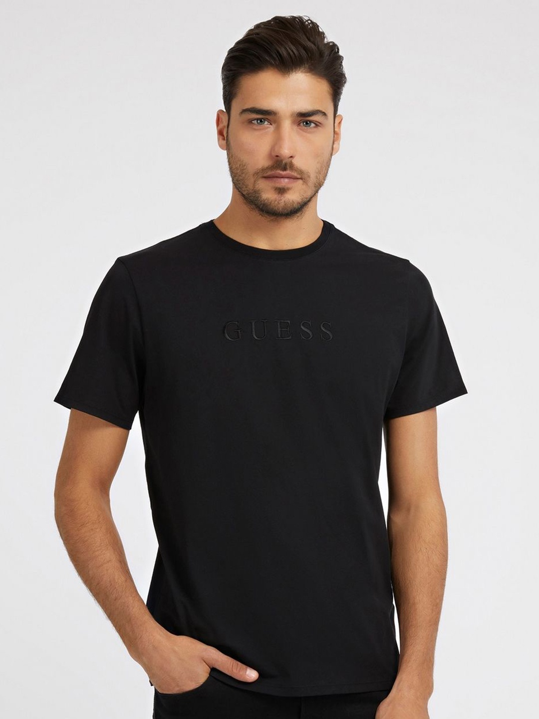 

GUESS Men Solid Round Neck Pure Cotton T-shirt, Black