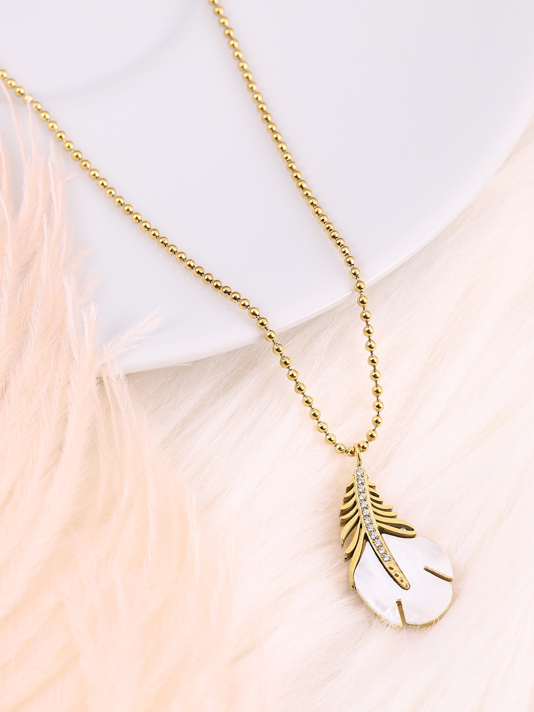 

DressBerry Stone-Studded feather Shaped Pendent With Chain, Gold