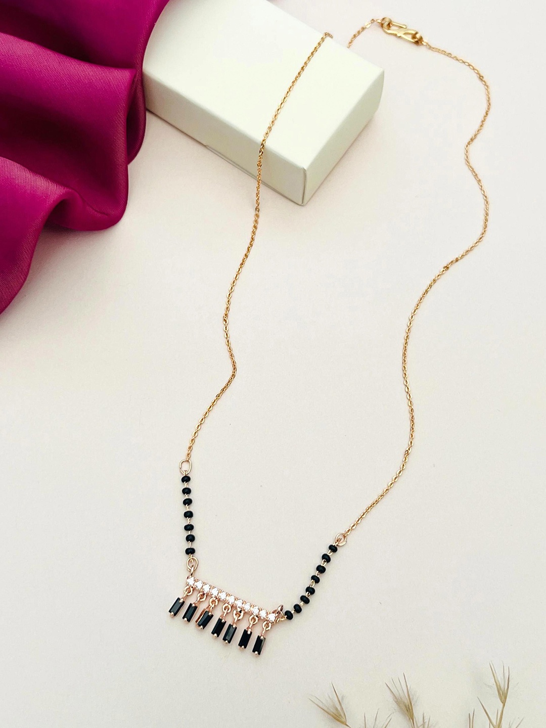 

Anouk Rose Gold Plated American Diamond Stone-Studded & Beaded Mangalsutra