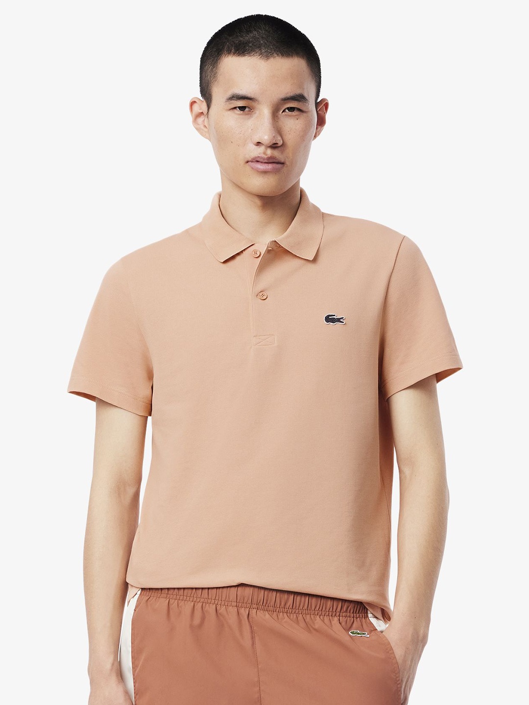 

Lacoste Men Solid Polo Collar Cotton T-shirt, Peach