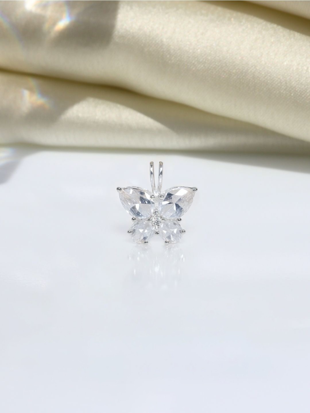 

HighSpark 92.5 Sterling Silver Cubic Zirconia Studded Butterfly Solitaire Pendant