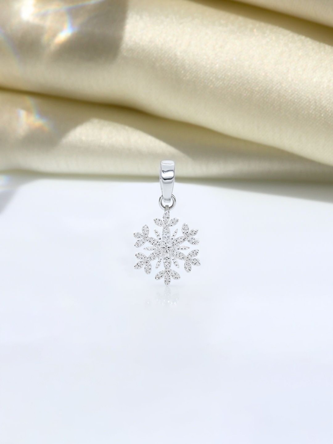 

HighSpark 92.5 Sterling Silver Cubic Zirconia Studded Snowflake Solitaire Pendant