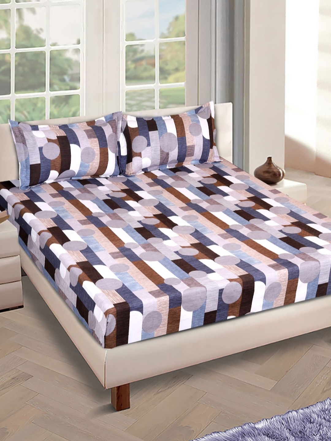 

Aura Blue And Brown Printed 210 TC King Bedsheet Set 2.69 m x 2.69 m