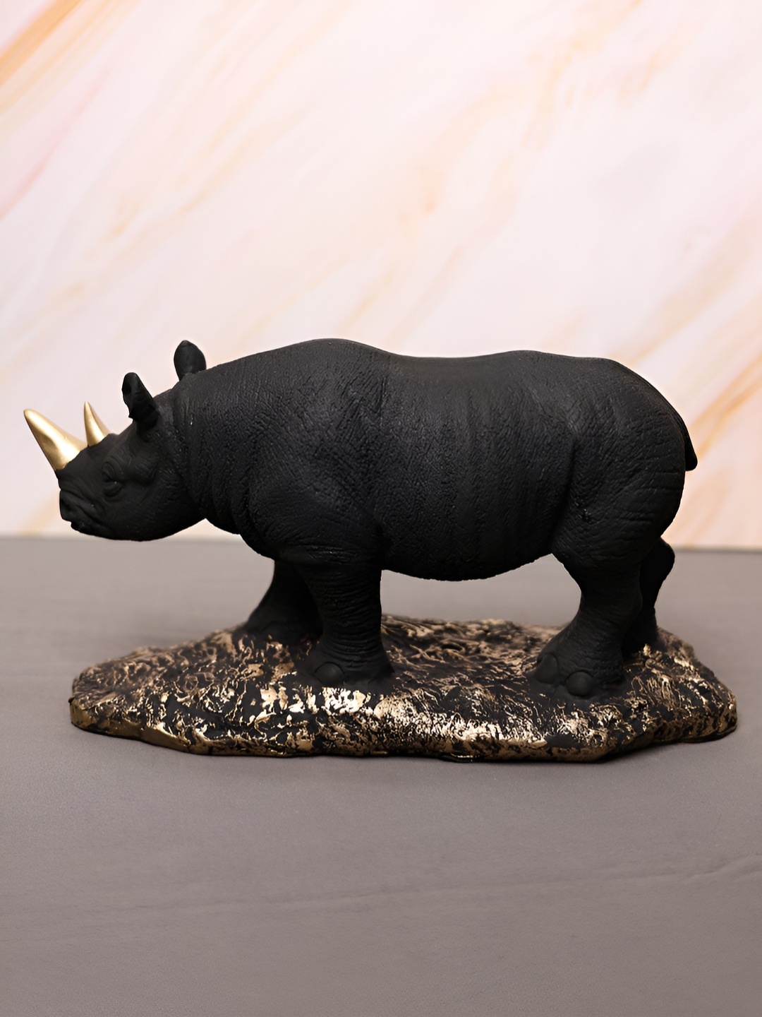 

SMOKEY COCKTAIL Black & Gold-Toned Rhino Figurine Birds And Animals Showpiece
