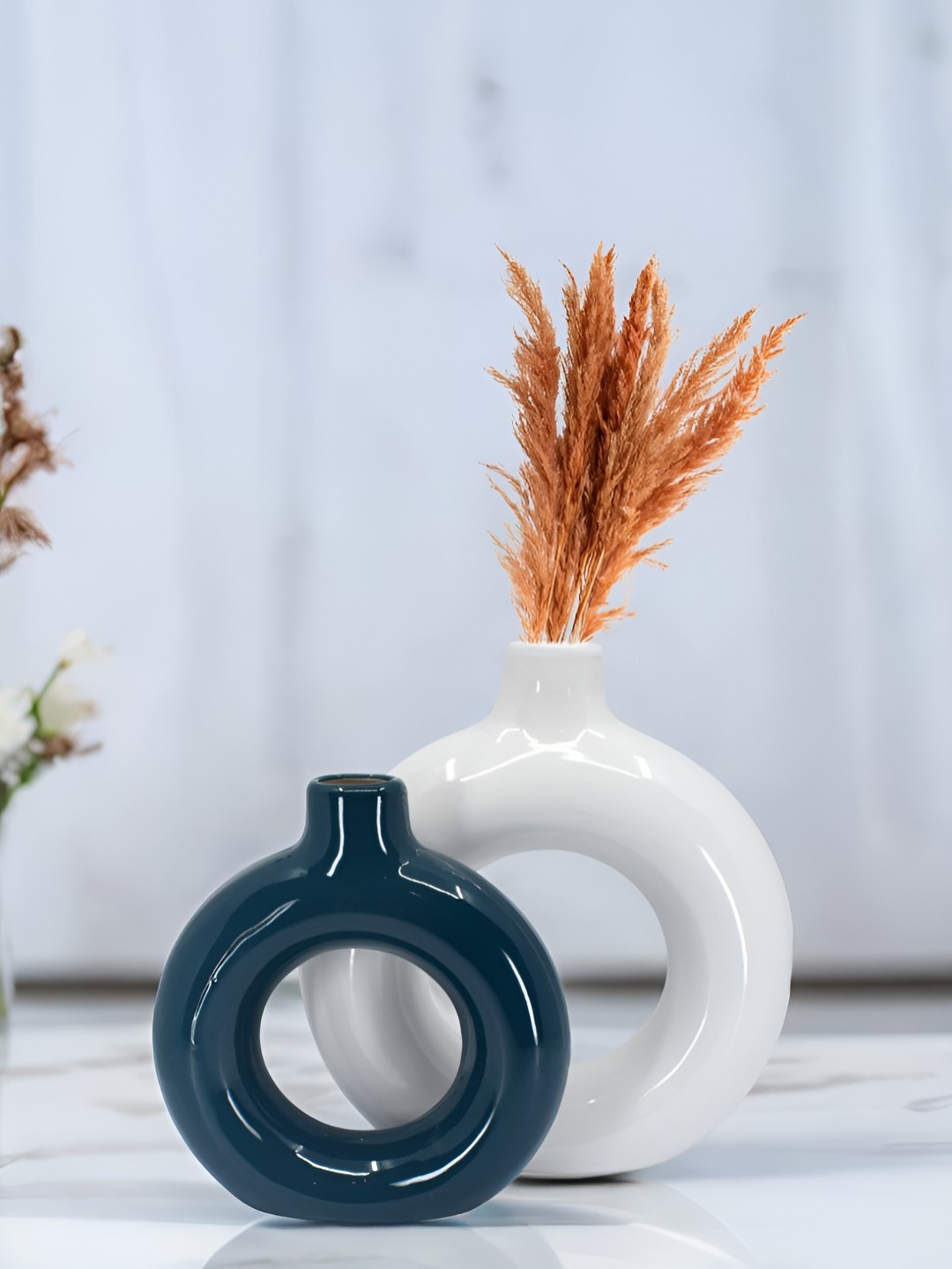 

The Decor Lane 2-Pcs White & Blue Ceramic Donut Vase