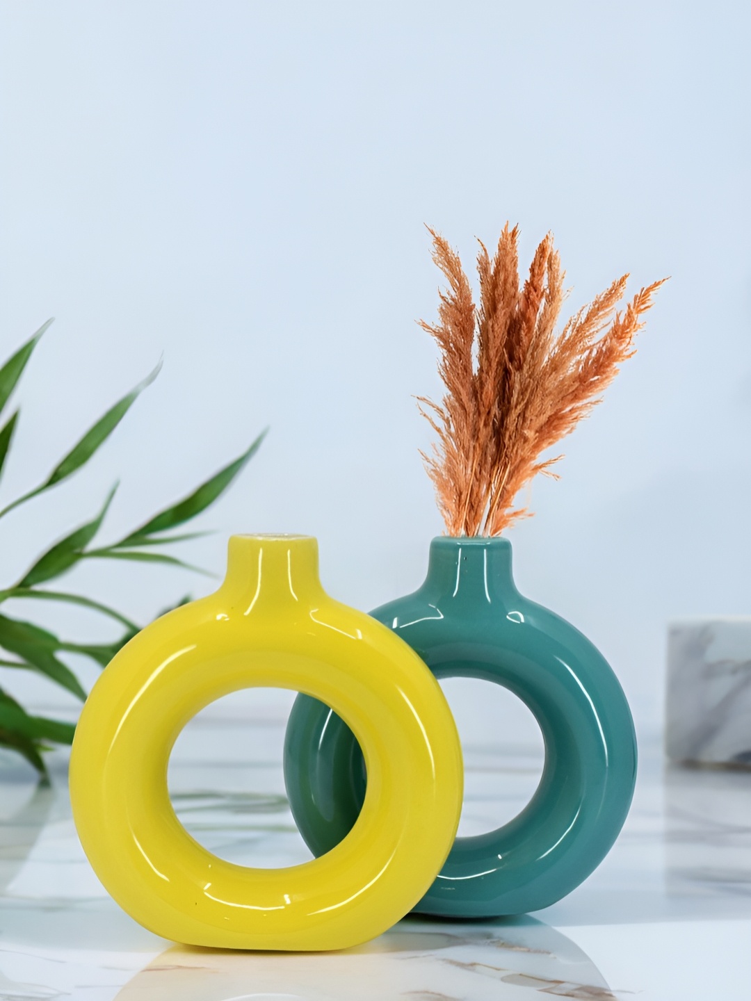 

The Decor Lane 2-Pcs Yellow & Teal Blue Ceramic Donut Vase
