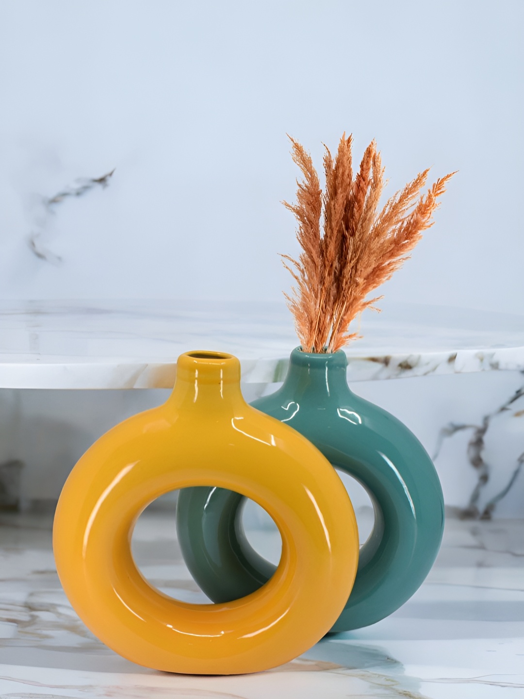 

The Decor Lane 2-Pcs Orange-Colored & Teal Blue Ceramic Donut Vase