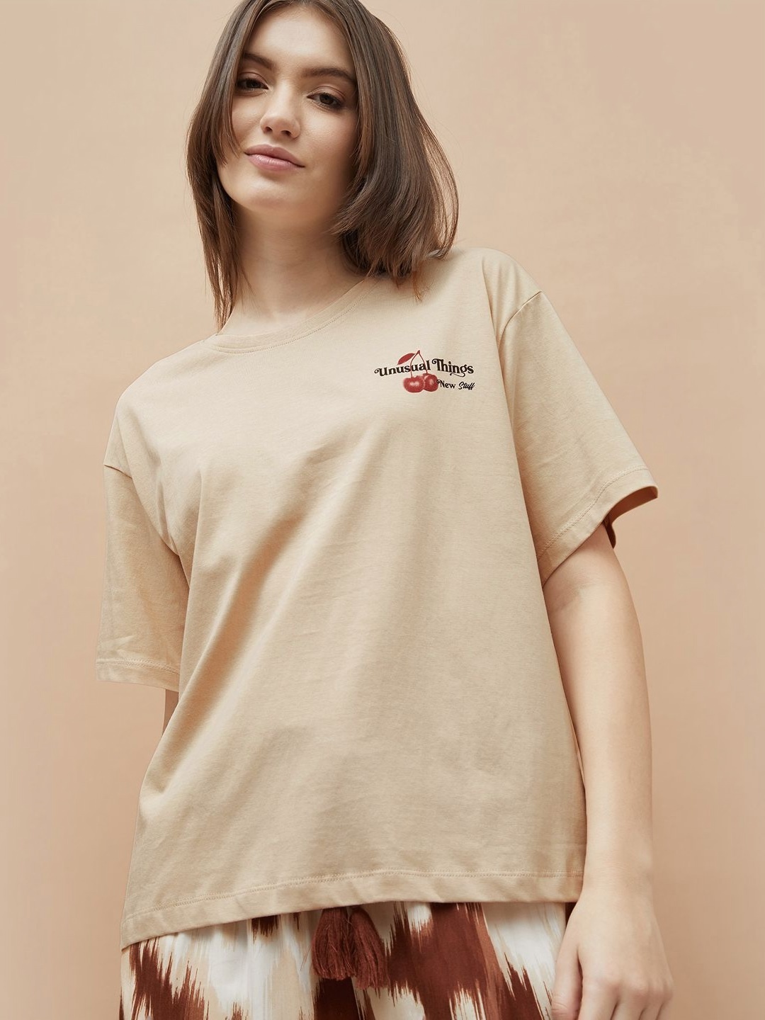 

Ginger by Lifestyle Women Typography Printed Pockets T-shirt, Beige