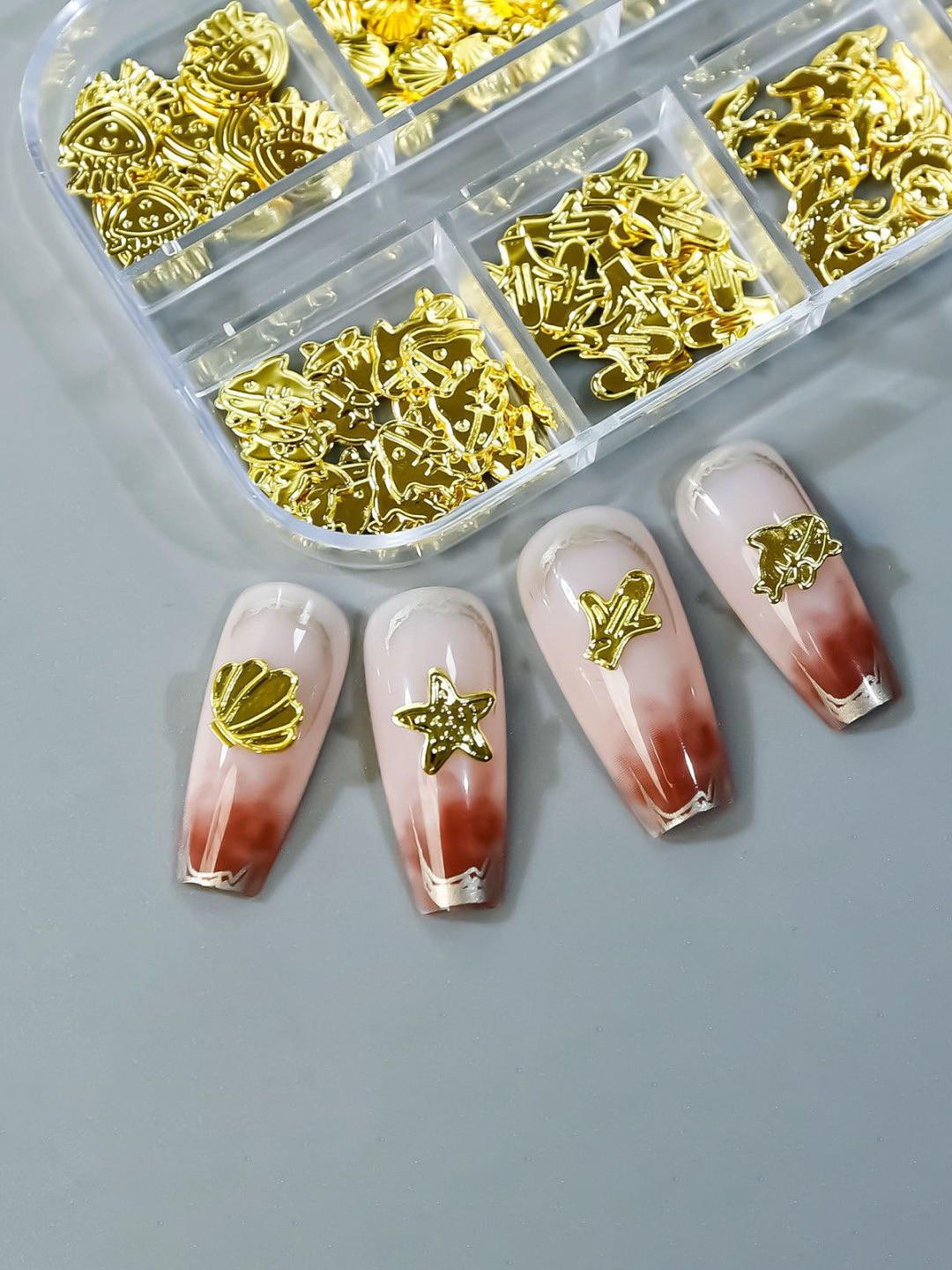 

Huda Girl Set Of 1200 Double-Sided Nail Glue With Sparkle Gold Metal Nail Studs, Transparent