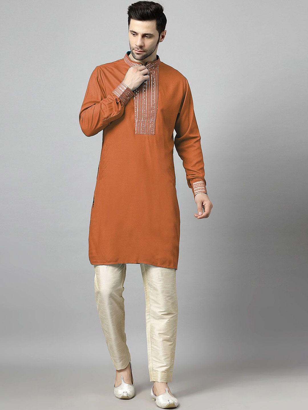 

Utsav Fashion Yoke Design Sequinned Mandarin Collar Straight Kurta with Trousers, Rust