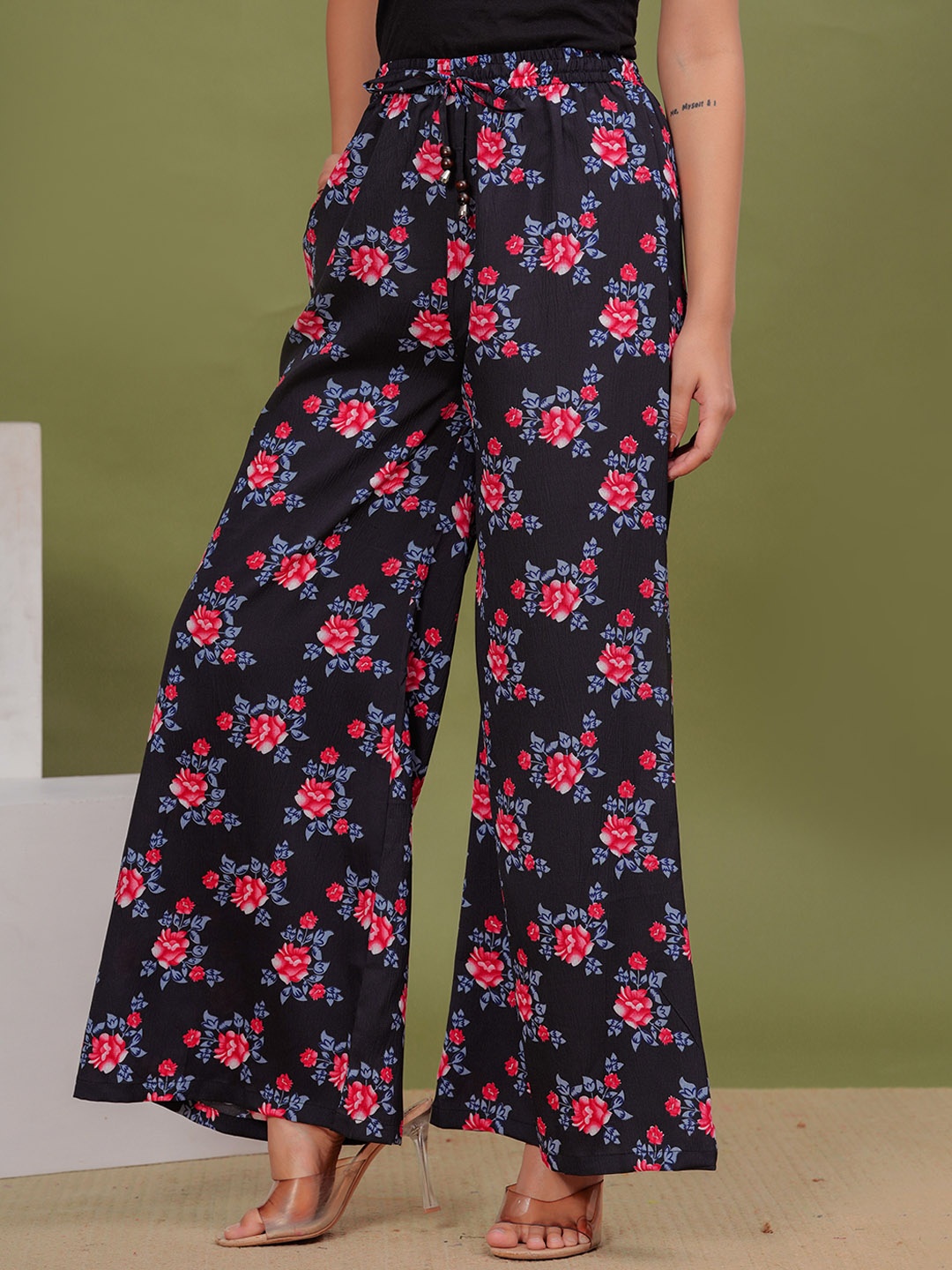 

Wakshi Kurti Women Floral Printed Mid-Rise Trousers, Black