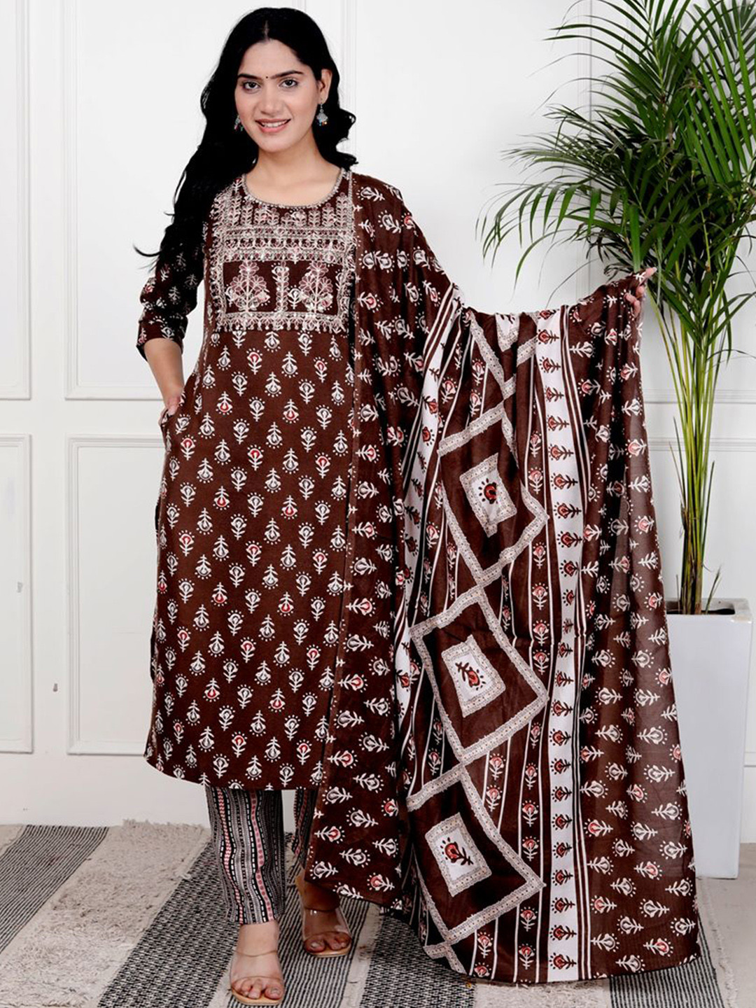 

HERE&NOW Floral Printed Thread Work Round Neck Straight Kurta With Trouser And Dupatta, Brown