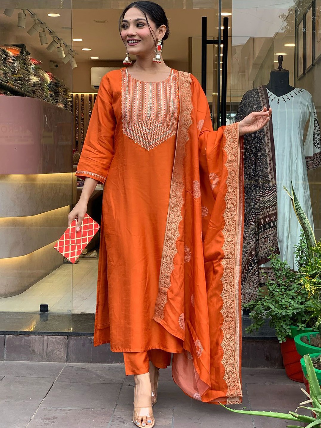 

KALINI Geometric Yoke Design Thread Work Chanderi Silk Kurta With Trousers & Dupatta, Orange