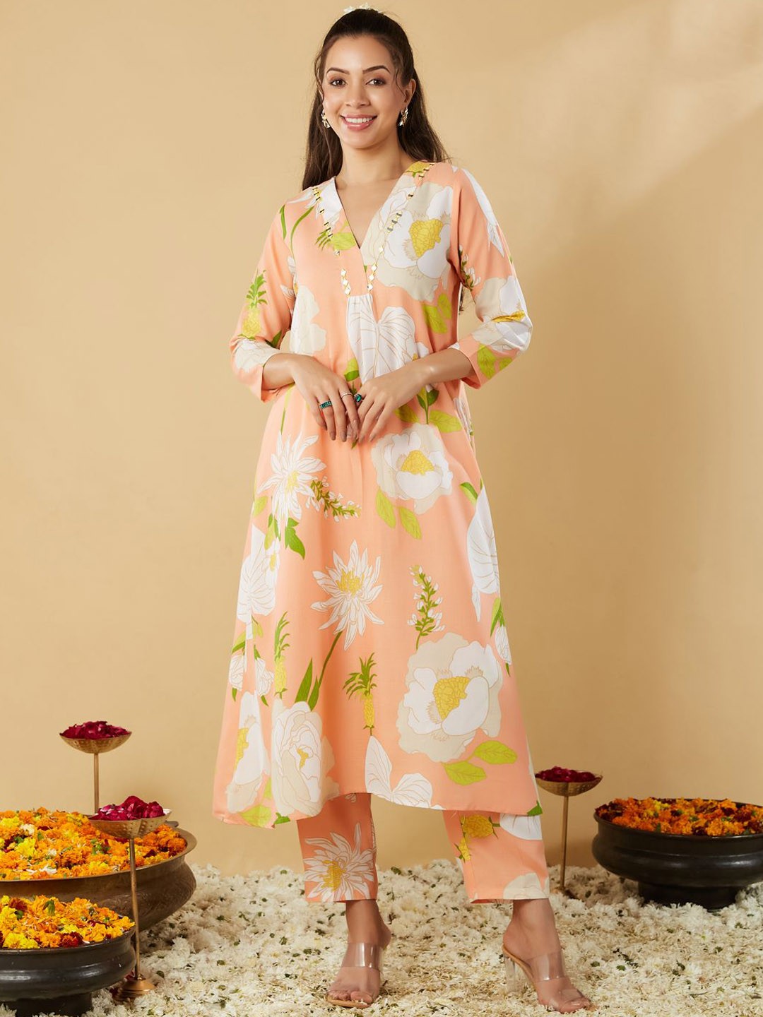 

MOKOSH Floral Printed Pleated V-Neck Mirror Work A-Line Kurta With Trousers, Peach