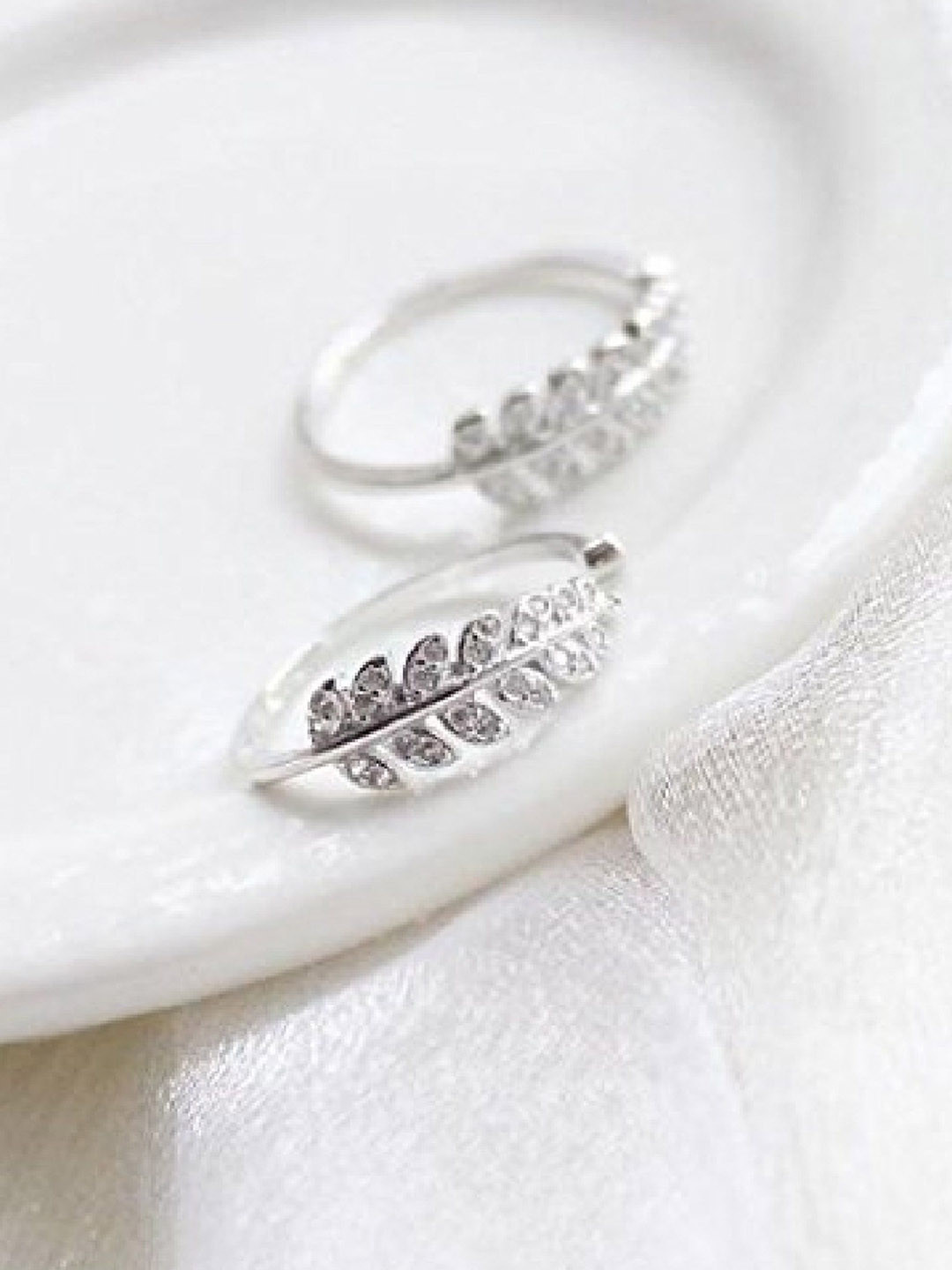 

RUHI COLLECTION Platinum Plated Stainless Steel AD Studded Leaf Adjustable Finger Ring, Silver