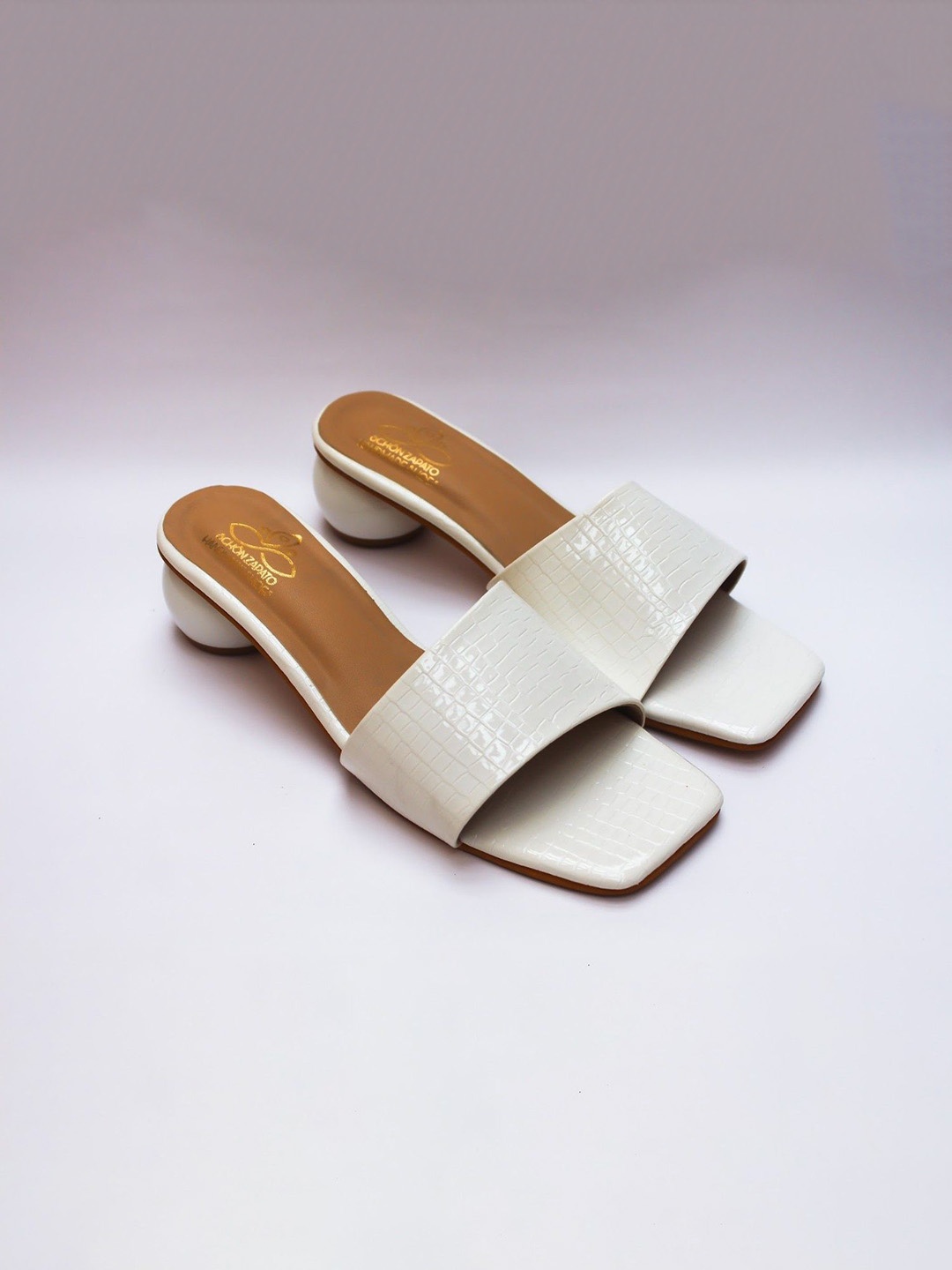 

Schon Zapato Textured Block Mules with Bows, White