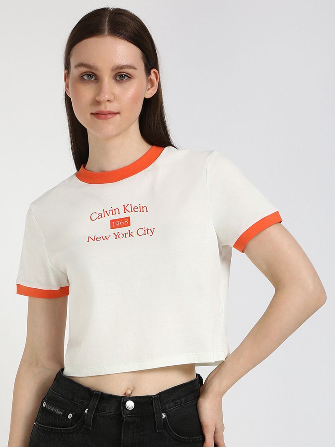 

Calvin Klein Jeans Women Typography Drop-Shoulder Sleeves T-shirt, Beige