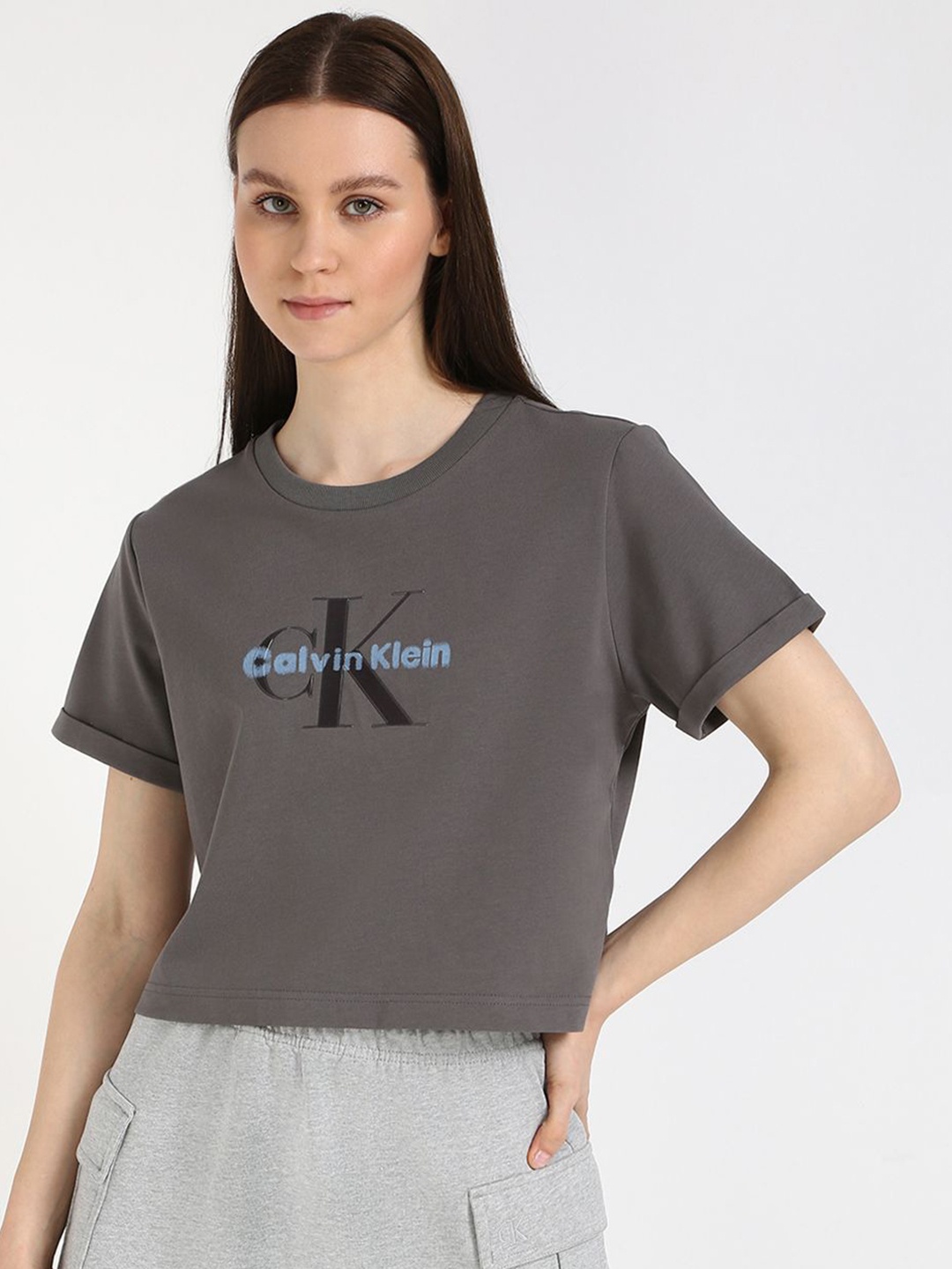 

Calvin Klein Jeans Women Typography Extended Sleeves Pockets T-shirt, Brown