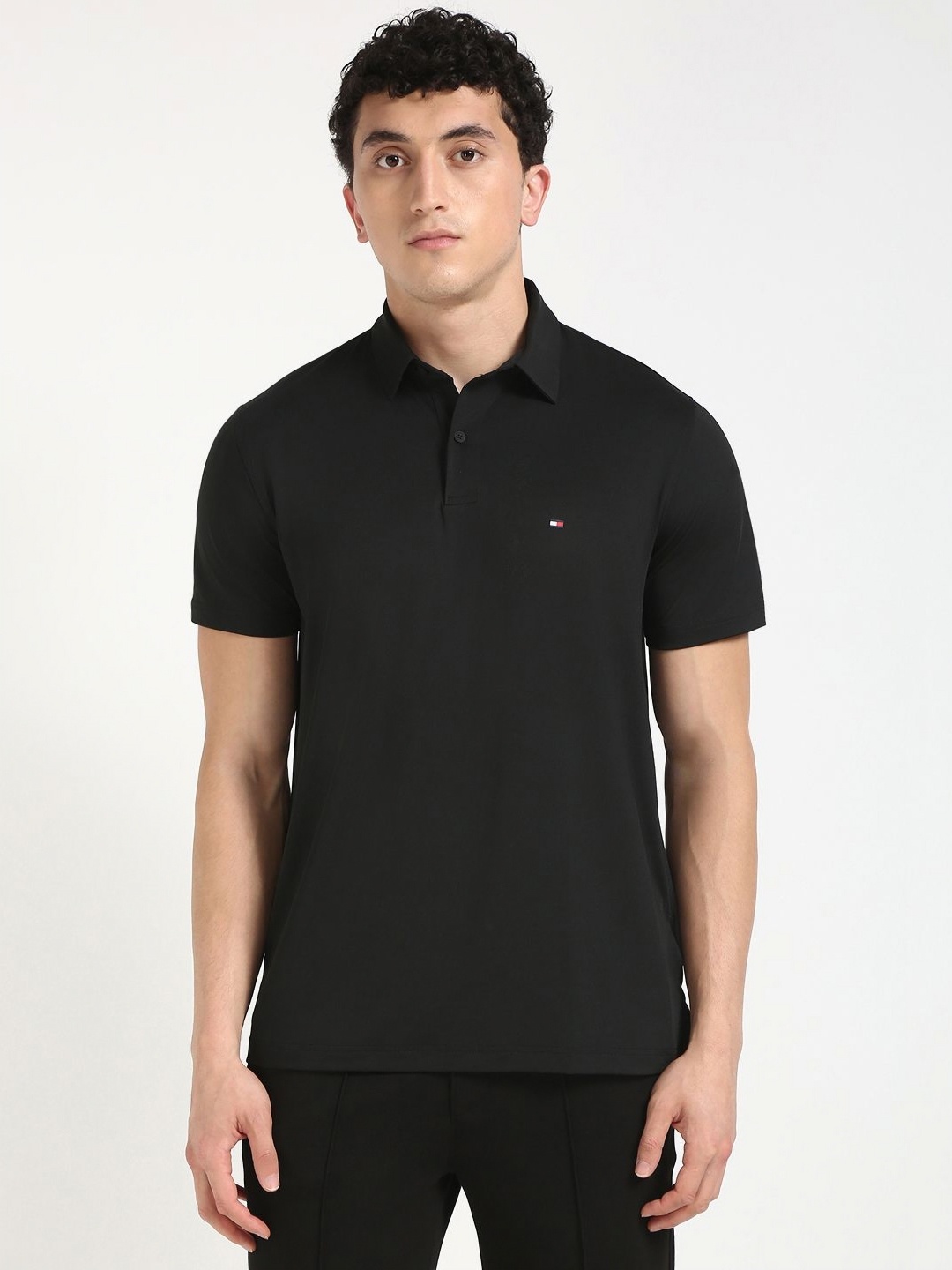 

Tommy Hilfiger Men Solid Polo Collar Cotton T-shirt, Black