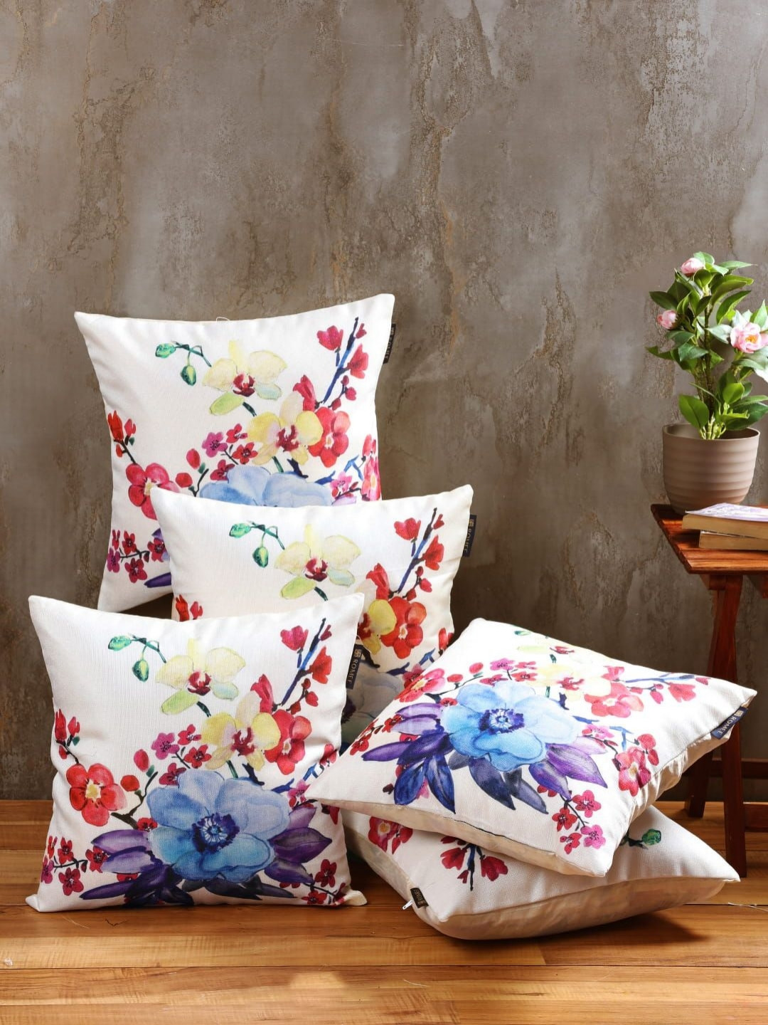 

Aura Cream & Blue 5 Pieces Floral Printed Jute Cotton Square Cushion Covers