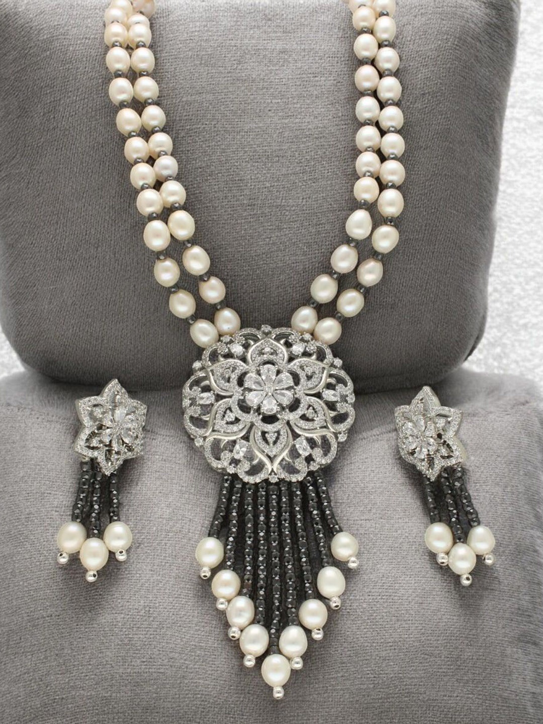 

Sri Jagdamba Pearls Dealer Silver Plated CZ Stone Studded & Beaded Jewellery Set