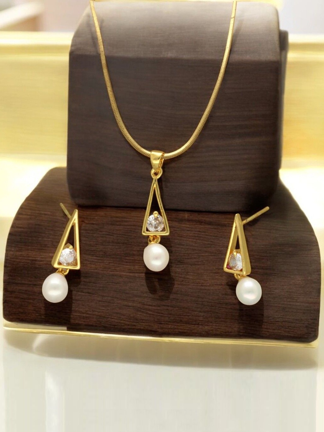 

Sri Jagdamba Pearls Dealer Gold Plated CZ Stone Studded & Beaded Jewellery Set
