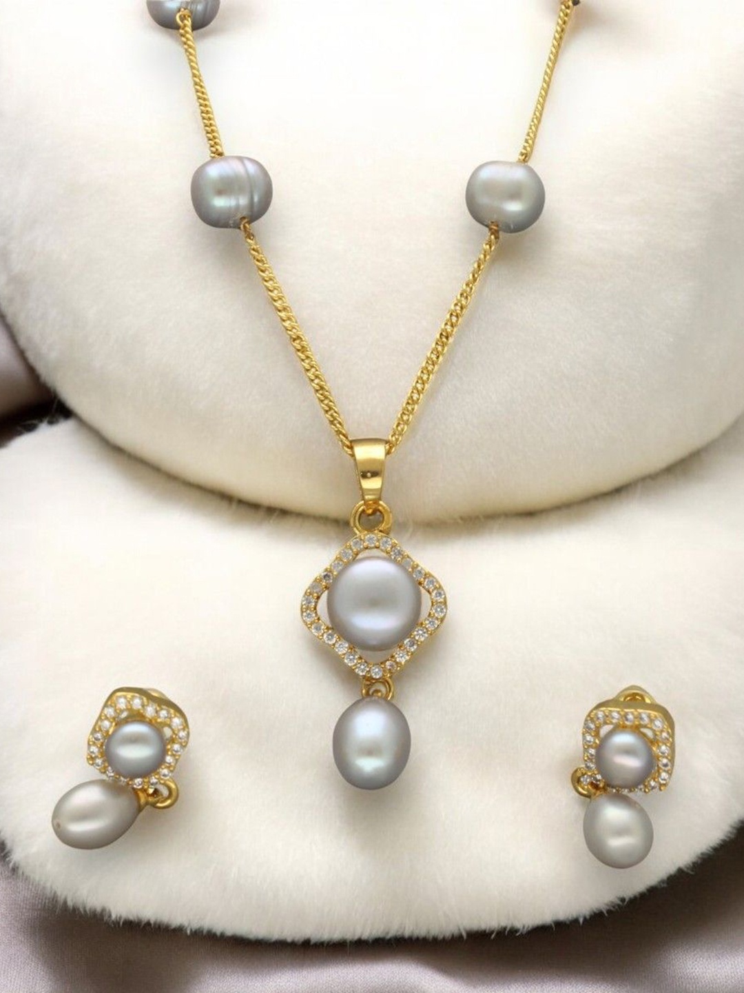 

Sri Jagdamba Pearls Dealer Gold Plated CZ Stone Studded & Beaded Necklace and Earrings