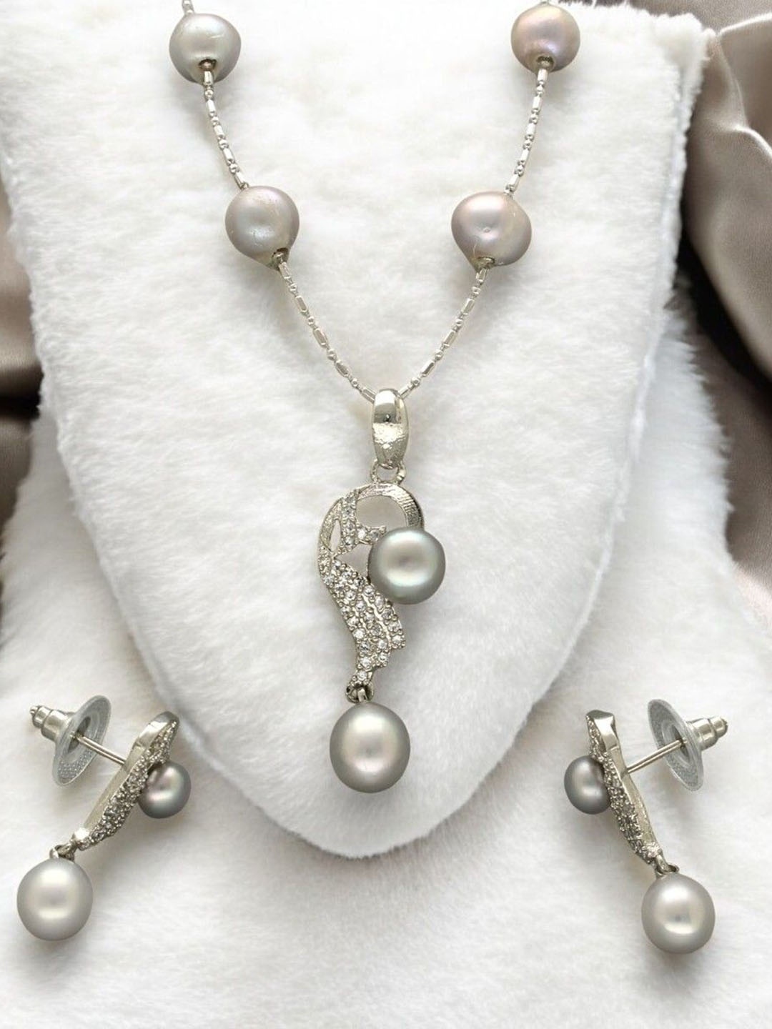 

Sri Jagdamba Pearls Dealer Silver Plated CZ Stone Studded & Beaded Jewellery Set