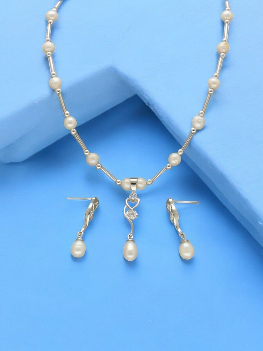 

Sri Jagdamba Pearls Dealer Silver Plated CZ Stone Studded & Beaded Jewellery Set