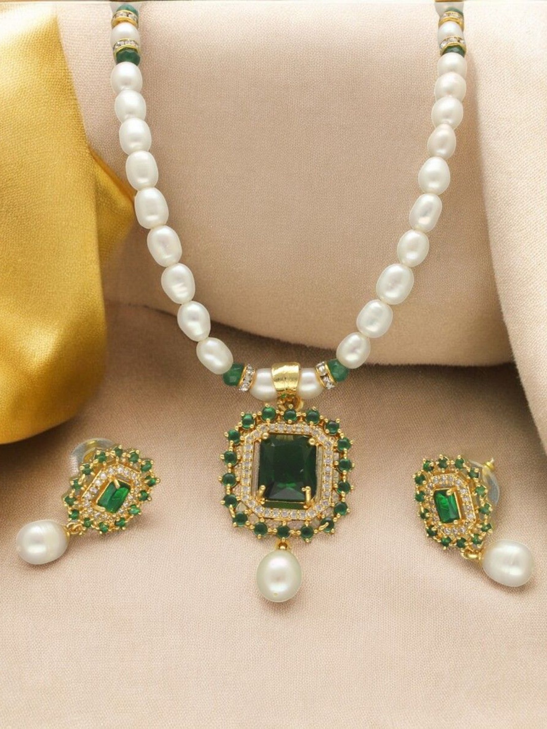 

Sri Jagdamba Pearls Dealer Gold Plated CZ Stone Studded & Beaded Jewellery Set