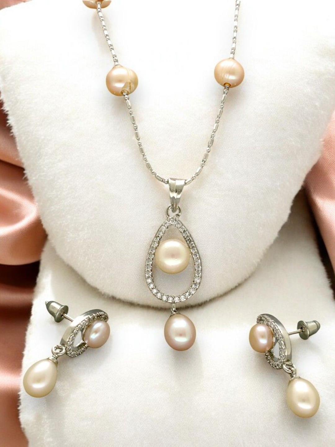 

Sri Jagdamba Pearls Dealer Silver Plated CZ Stone Studded & Beaded Jewellery Set