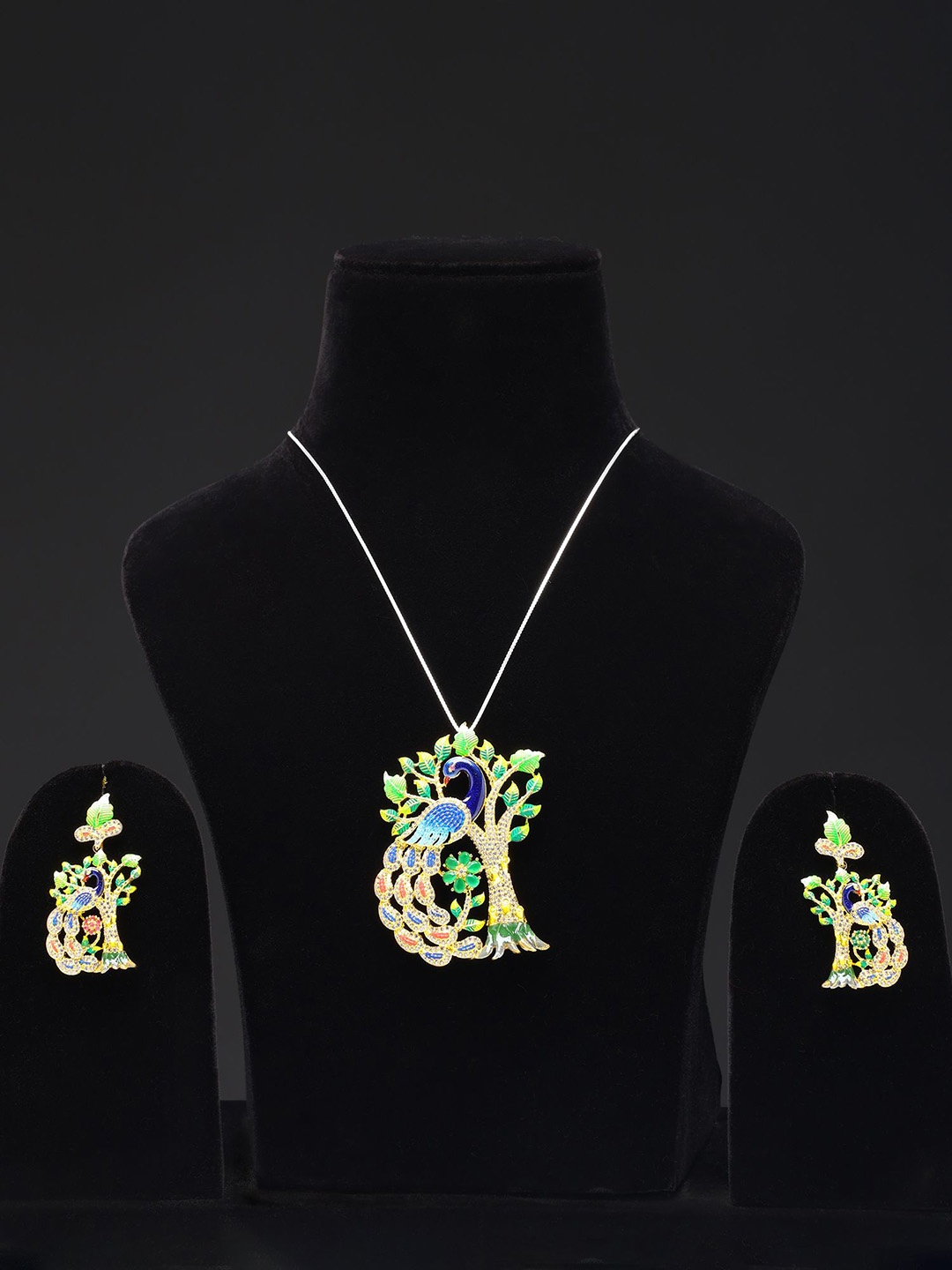 

Exotic India Designer Peacock Pendant and Earrings Set with Cubic Zirconia Jewellery Set, Gold