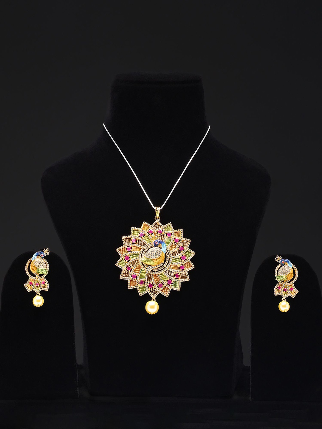 

Exotic India Multicolor Floral Peacock Pendant and Earring Set with Ruby & Cubic Zirconia, Gold