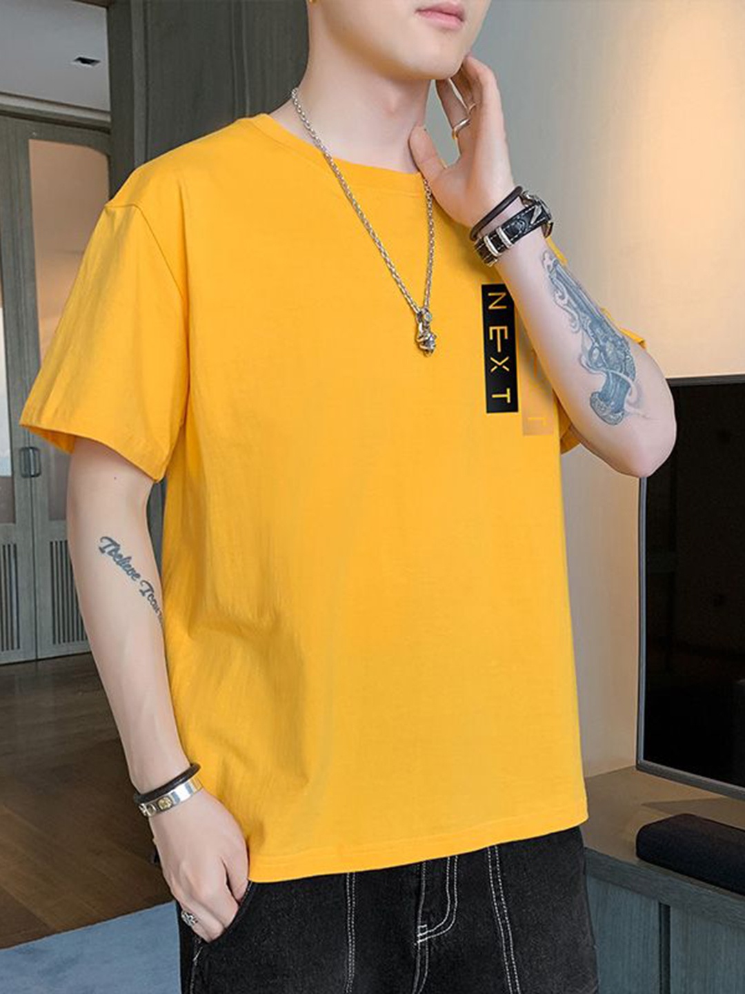 

StyleCast x Revolte Men Typography Printed Round Neck Relaxed Fit T-shirt, Yellow