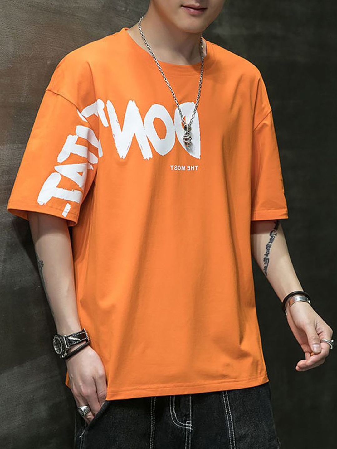 

StyleCast x Revolte Men Typography Printed Round Neck Cotton Boxy T-shirt, Orange