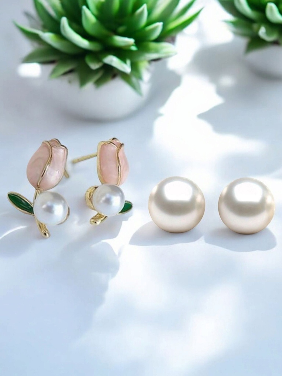 

Vighnaharta Set Of 2 Gold-Plated Pearls Studded Floral Shaped Studs