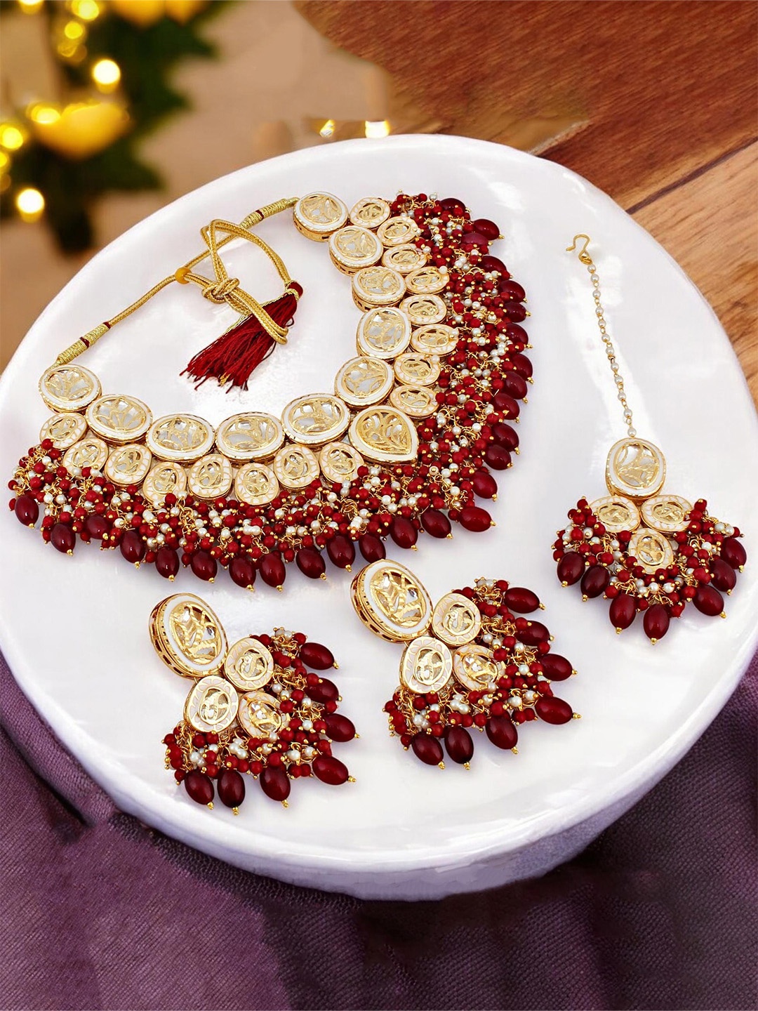 

LUCKY JEWELLERY 18KT Gold Plated Kundan Studded & Beaded Necklace and Earrings Maang Tika