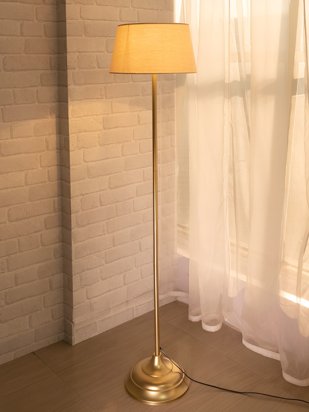 

Homesake Gold Toned & Cream Coloured Cylinder Shaped Wooden Floor Lamp