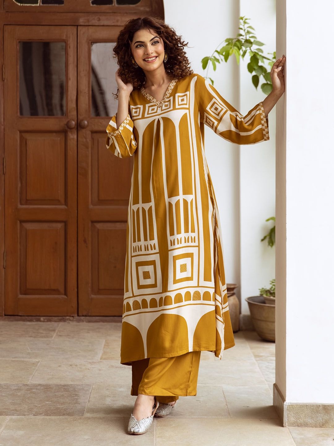 

Ishin Ethnic Motifs Printed V-Neck Straight Kurta With Palazzos, Mustard