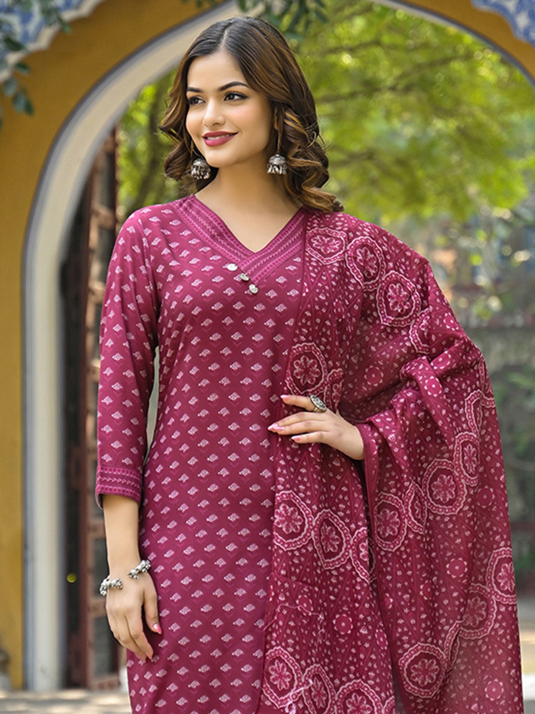 

AHIKA Floral Printed V Neck Straight Kurta With Trousers & Dupatta, Maroon