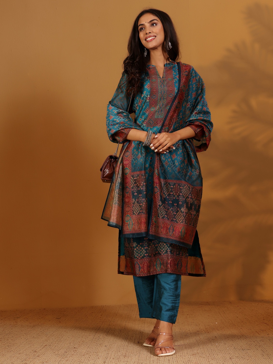 

Varanga Women Printed Regular Chanderi Silk Kurta with Trousers & With Dupatta, Teal