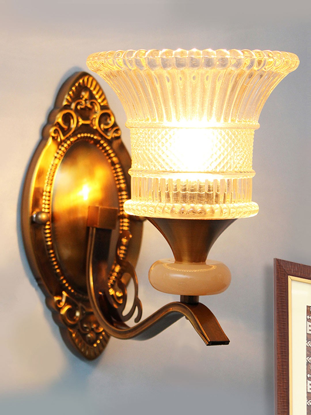 

SHREE KALA HOME DECOR Brown & Transparent Textured Metal Frustum Shaped Wall Lamp